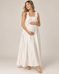 Woman in a white ruffle-strap maternity maxi dress, mirror selfie, front view